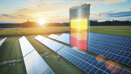 3D animated battery graphic over solar panel field with engineer working at sunset, clean energy...