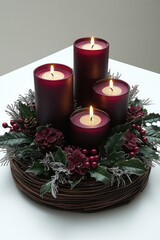 Elegant candle arrangement with holiday greenery