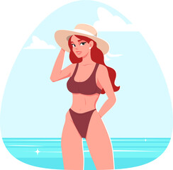 Beautiful girl in bikini and summer hat on beach