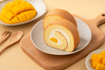 Delicious mango cream Swiss roll cake on plate
