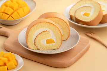 Delicious mango cream Swiss roll cake on plate