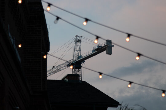 tower crane through festoon lighting