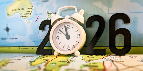 Clock and 2026 Numbers on a World Map Representing Time, Travel, and Global Planning