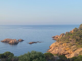 Beautiful coastal cliff landscape in Costa Brava, Catalonia at dusk in the quiet Mediterranean Sea