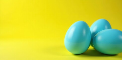 Obraz premium Stylized blue eggs, yellow backdrop, Easter concept , painted, vivid, minimalist