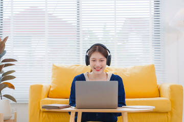 Smiling Woman Working from Home with Laptop