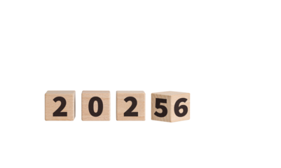 Wooden blocks with "2025-2026" text on a white background enhance New Year celebrations. Their wooden texture brings a cozy feel to holiday decorations.