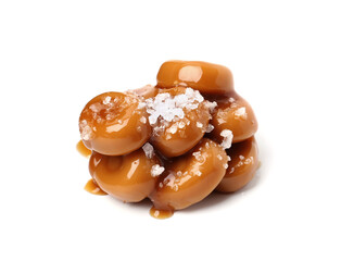 Tasty sweet candies, salt and caramel sauce isolated on white