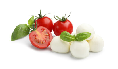 Tasty mozzarella cheese balls, tomatoes and basil isolated on white