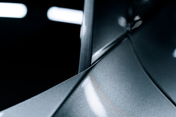 Close-up of car roof with applied PPF film – high-gloss finish, precise edge application and...