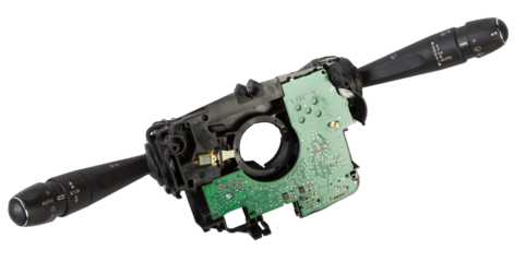 Steering wheel switches for windshield wipers and turn signals with steering angle sensor disassembled on a white isolated background, spare part for car repair or for sale at junk yard.