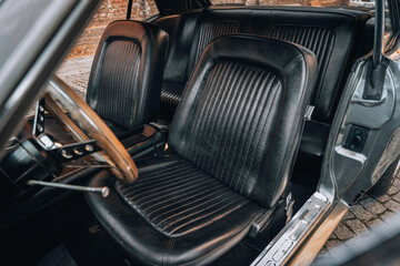 Close-up interior view of a classic American muscle car automatic transmission shifter with chrome finish and vintage seats – retro automotive design captured for restoration, martketing press.