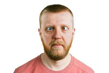 Man in a pink shirt with a sidelong glance.