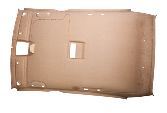 Finishing the gray ceiling roof from a car removed and disassembled for repair and hauling with new material after prolonged use or during tuning. Auto service industry. Spare parts catalog.