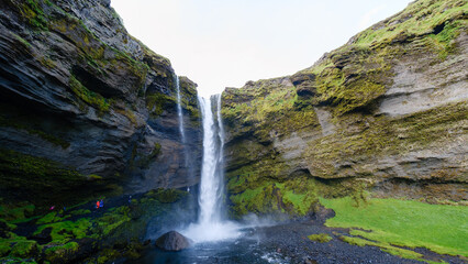 Majestic Kvernufoss waterfall cascading down mossy cliffs in Iceland stunning landscape