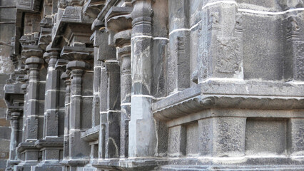 Carved stone walls and pillars of a temple in Tamil Nadu, India