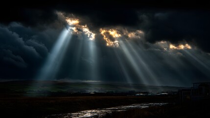 Dramatic Sunbeams Breaking Through Dark Storm Clouds Over Mountain Landscape perfect for environmental campaigns, cinematic backdrops, nature documentaries, spiritual themes weather-related content