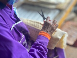 hands of a girl playing with a thread