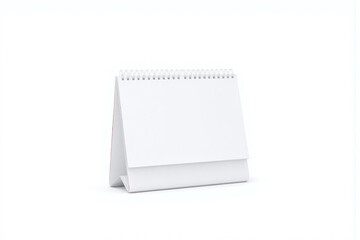 desk calendar with a folded sheet of paper on top of it