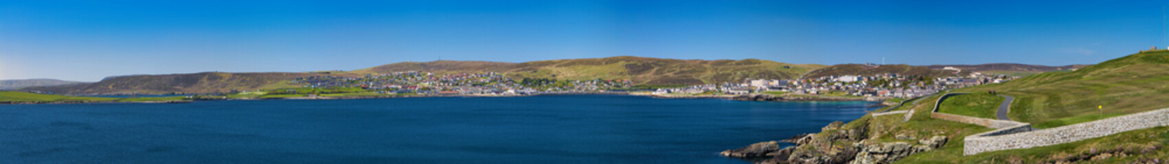 A panoramic view of the community of Sound and the town of Lerwick on a clear day in Shetland, UK.
