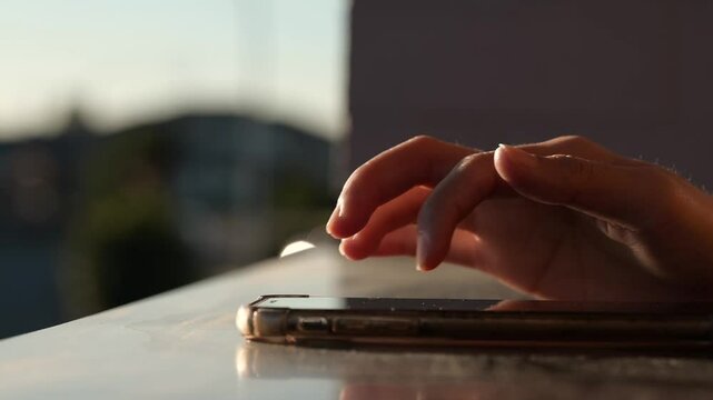woman hand typing on smart mobile phone for texting or online banking shopping or surfing on internet