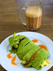 Sandwich vegan wrap and glass of hot tea