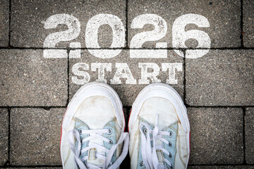 New Year 2026 Start Concept with Sneakers on Pavement and Painted Motivation Message