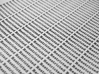 Words Restricted Seamless print on paper for business background.