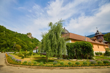 image from the outside of a church in Romania with paintings specific to the area and the Orthodox...