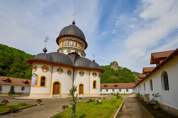 image from the outside of a church in Romania with paintings specific to the area and the Orthodox...