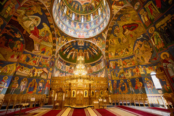 image from inside a church in Romania with paintings specific to the area and the Orthodox religion