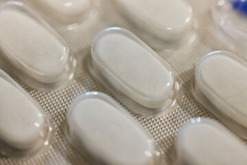 close up of a foil of pills on a table