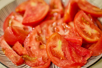 close up of tomato slices on a plate