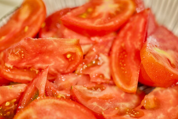 close up of tomato slices on a plate
