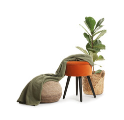 Stylish pouf and home decor isolated on white