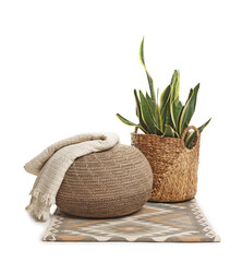 Stylish pouf and home decor isolated on white