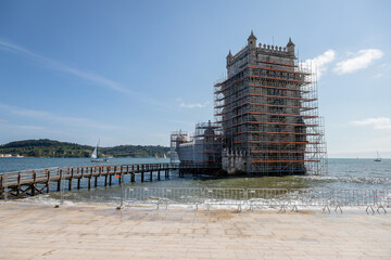 The Belem Tower in Lisbon, Portugal, undergoing restoration in June 2025, surrounded by scaffolding to preserve its iconic Manueline architecture for future generations.