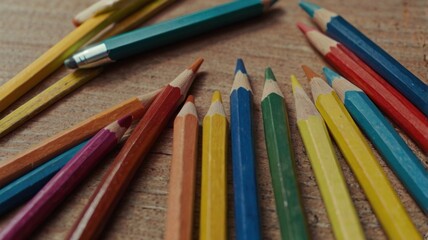 Fototapeta premium colored pencils on a wooden table