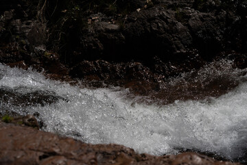 flowing water tumbling down a creek over rocks