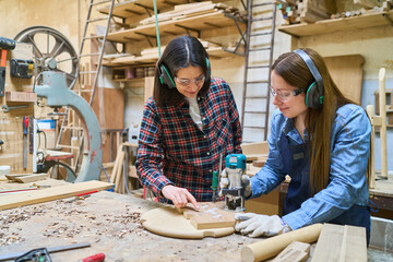 Collaborative woodworking in a bustling lumber workshop