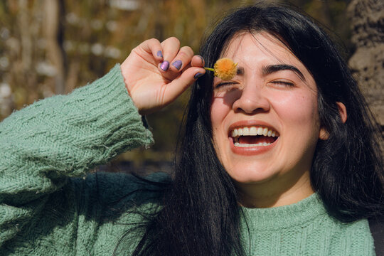 happy young Venezuelan woman smiling outdoors