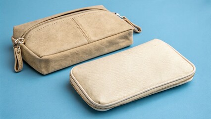 Two Beige Canvas Cosmetic Bags on a Light Blue Background for Beauty Products