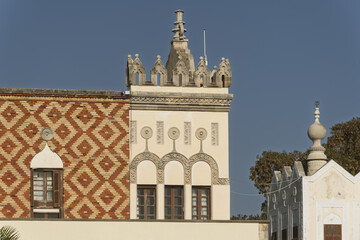 Close-up of a historic building in Rhodes, Greece, façade displays decorative arched windows,...