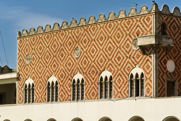 patterned brick facade facing the harbor of South Aegean Region Government Building, Platia Eleftherias, New Town, Rhodes, Greece