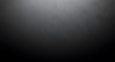 Subtle textured dark gray background with soft spotlight effect and gradual fade to black