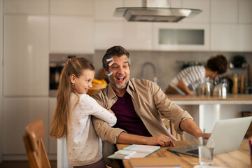 Father and Daughter Bonding During Work and Playful Moments at Home