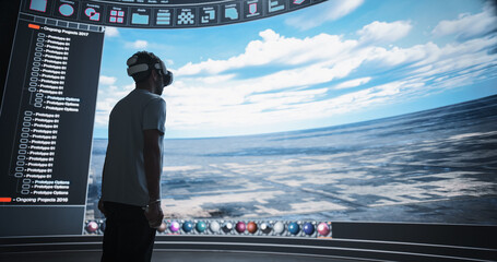 Landscape Designer in a VR Headset Designs Scenic Nature Panorama on a Big Panoramic Digital Screen...
