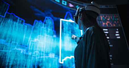 Young Female Architect Creates a Parametric Design of a Big Futuristic City with Skyscrapers....