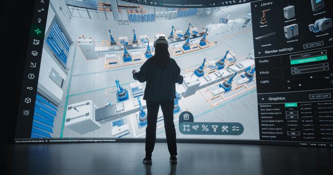 Robotics Specialist Programs a Group of Robotic Arms with the Help of Virtual Reality Metaverse. Specialist Utilizes VR to Program the Assembly Line, Optimize Production and Improve Efficiency