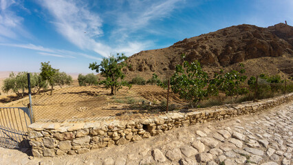 Rural Landscape with Stone Wall and Rocky Hill